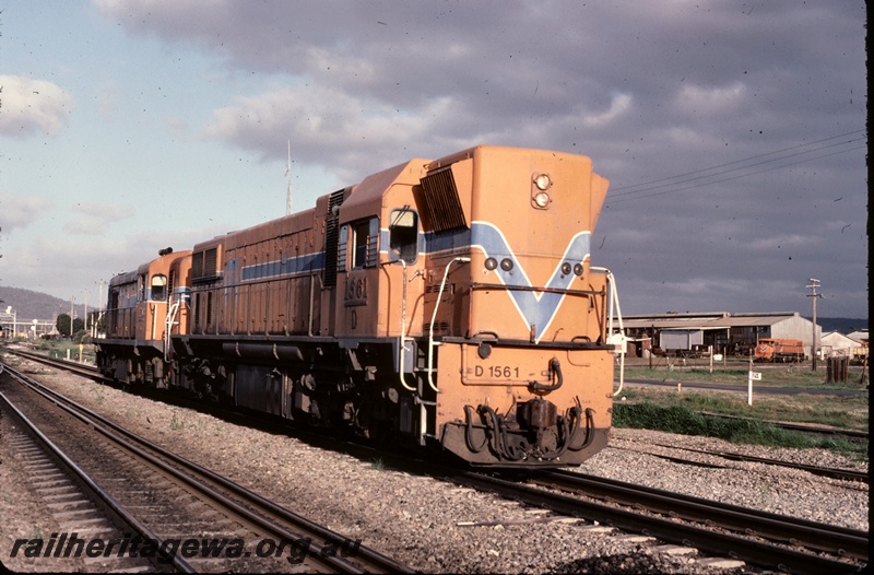 P16664
D class 1651, and another diesel loco, both in Westrail orange with blue and white stripe, side and end view
