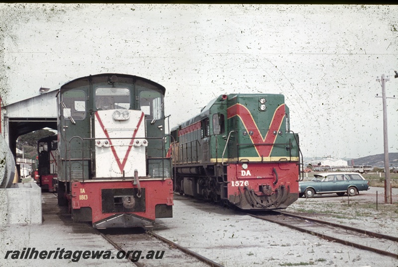 P16672
TA class 1813, with end painted white with red V, DA class 1576, in green red and yellow, loco depot, front on views
