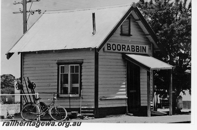 P16692
Station building, weatherboard and tin, point levers, bicycle, Boorabbin, EGR line
