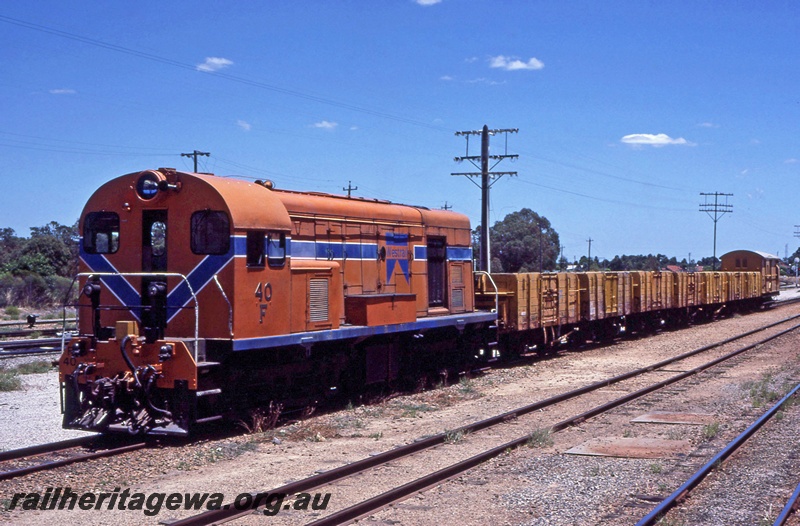 P16714
Westrail, F class 40, Westrail orange livery, Midland, ER line, goods train, four wheel GM class wagons.
