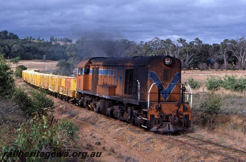 P16723
Westrail G 51, Westrail orange livery, Donnybrook, DK line, goods train, empty four wheel wagons.
