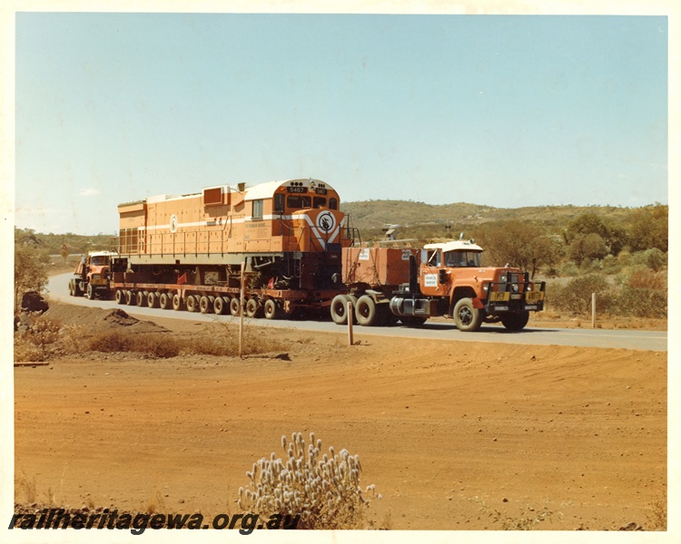 P16741
Mount Newman (MNM) C636 class 5467 being transported on a low loader en route to Vickers Hoskins for rebuilding. Photo taken on Great Northern Hwy near Munjina.
