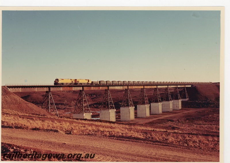 P16743
Cliffs Robe River (CRRIA) M636 class locomotives haul loaded ore train over the 366m long Fortescue River bridge. The bridge is 33.5 m above the river bed.
