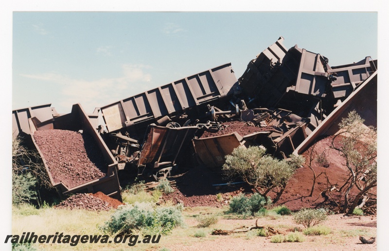 P16767
Mount Newman (MNM) loaded ore train derailment 243-246 km. Loss of 88 ore cars 
