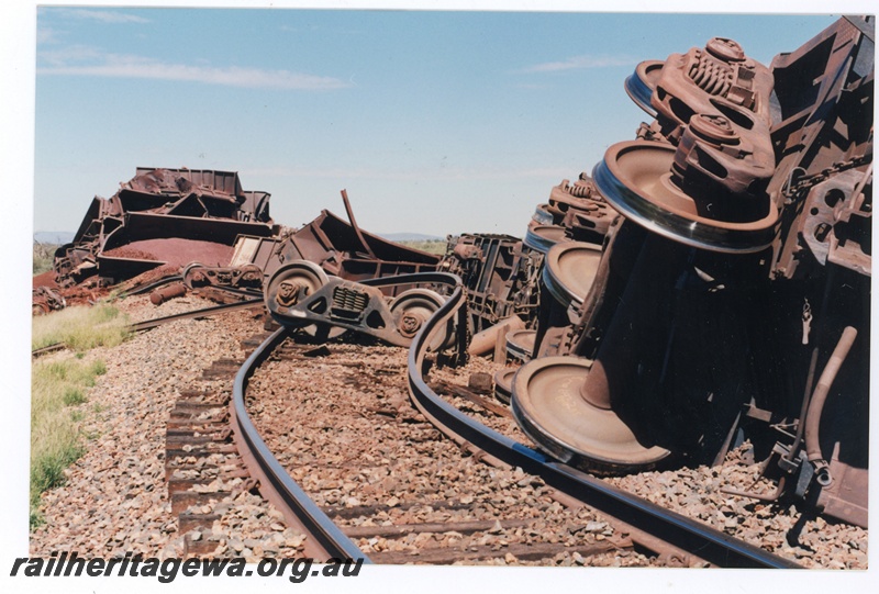 P16768
Mount Newman (MNM) loaded ore train derailment 243-246 km. Loss of 88 ore cars 
