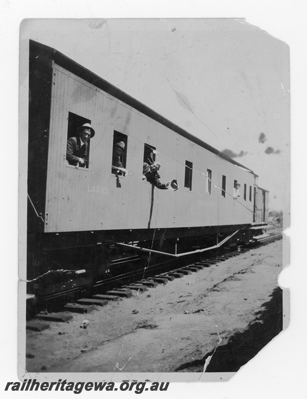 P16825
Commonwealth Railways (CR) Line workers look out of carriage windows of a construction train. TAR line, Names of men in photo: Dave Brown, Costello, O'Leary, Horseborough C1916
