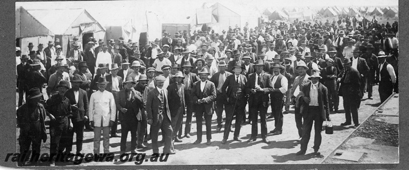 P16830
Commonwealth Railways (CR) - TAR line track workers gather to witness the official opening of line.
