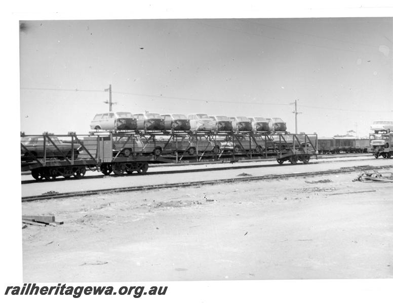 P16873
Commonwealth Railways (CR) - TAR line partially assembled Holden motor vehicles awaiting trans-shipment to WAGR narrow gauge wagon at Parkeston.

