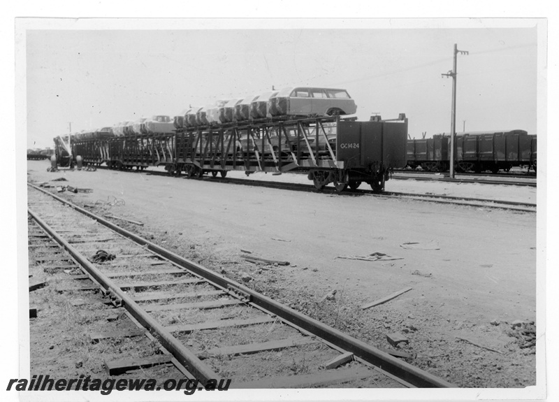 P16875
Commonwealth Railways (CR) - TAR line GC class 1424 car transporter wagon loaded with Holden motor vehicle bodies at Parkeston. The Holden car bodies were transported by WAGR narrow gauge train to Cottesloe for assembly at GMH plant at Mosman Park.
