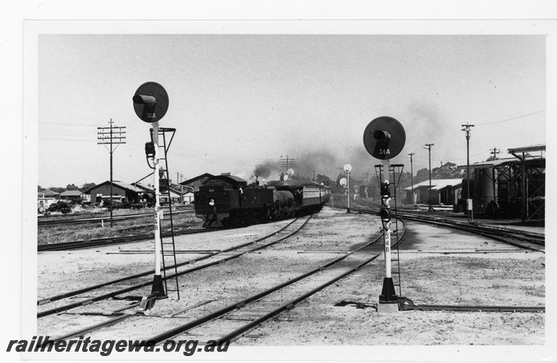 P16929
DM class 586 approaches Midland Station hauling ARHS tour train to Gingin. Colour light signals in photo and Midland diesel locomotive depot on right of photo. MR line.
