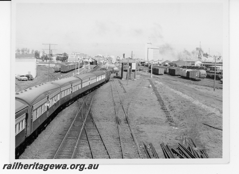 P16935
X class approaches Fremantle hauling a hired special train to Mundijong. Photo taken from footbridge at north end of station shows signal box and goods yards. ER line. 
