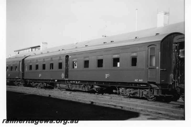 P16981
AZ class 441 first class sleeping car, on recently arrived express train, canvas water bag on platform of next car, side and end view 
