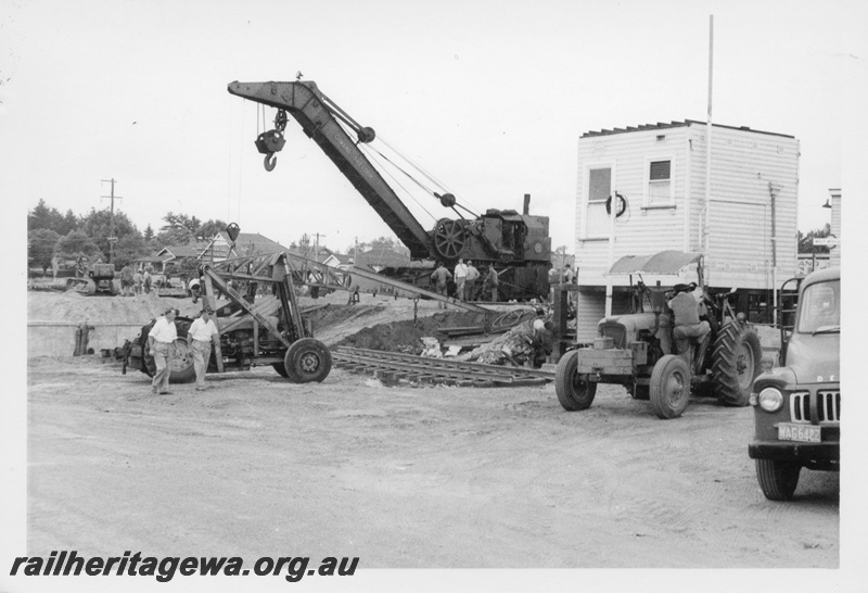 P17016
Cowans Sheldon 60 ton Breakdown Crane No 31, demolition of station, tractor, station buildings, West Midland, ER line.
