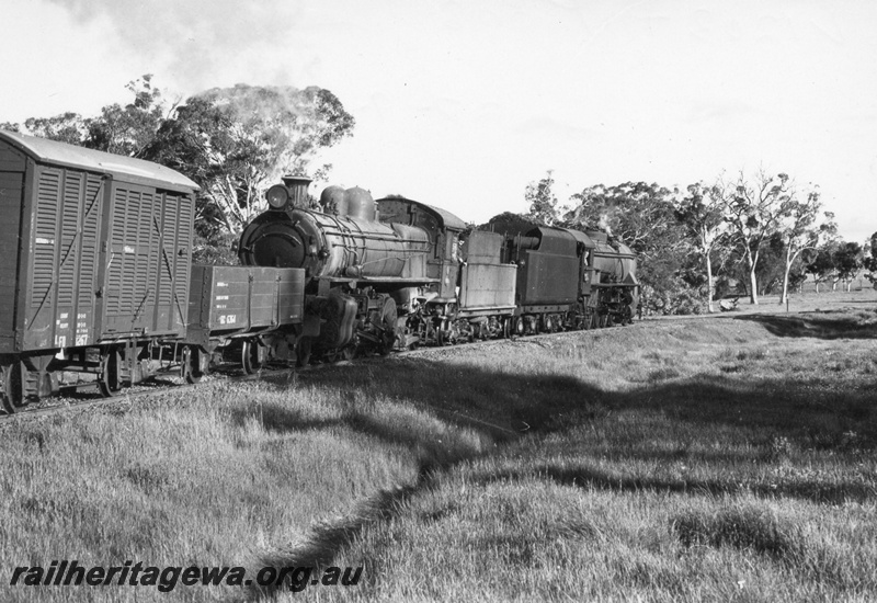 P17031
V class 1203, hauling P508 tender first, at the head of a goods train. First wagon is steel underframed GC class 6464 open wagon, Location Unknown but possibly mid GSR line.
