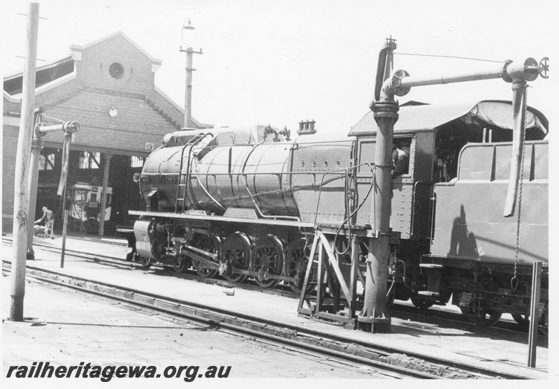 P17043
S class 549 Greenmount at East Perth Loco. Note the suburban rail car in the shed and the water column & stand next to the locomotive.
