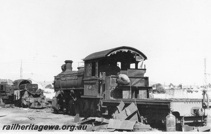 P17067
FS class 459 steam locomotive on the scrap road, tender mostly cut up, side and end view, tubes of F class 455 exposed, Midland workshops.
