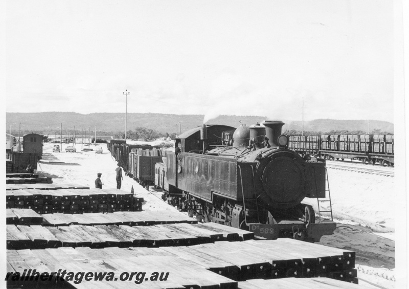 P17085
DM class 588 steam locomotive on a Kewdale shunt, stacks of sleepers, SWR line.
