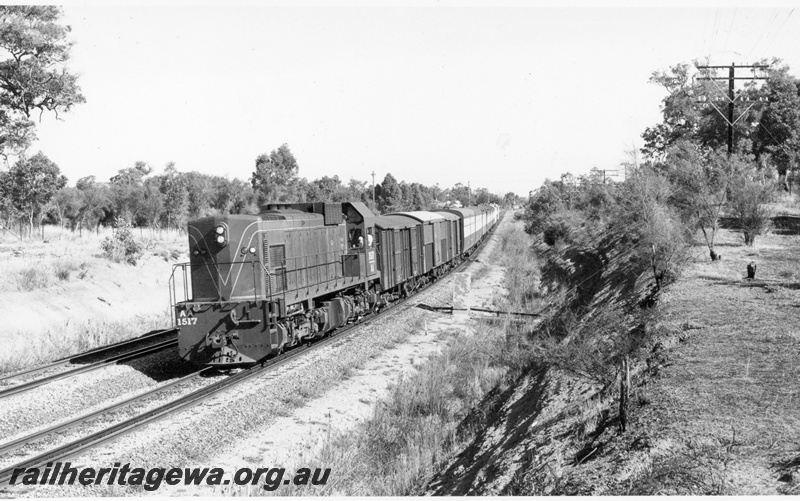 P17090
AA class 1517 diesel locomotive hauling The Kalgoorlie Express in the vicinity of Helena Vale. Front & side view of loco. ER line 
