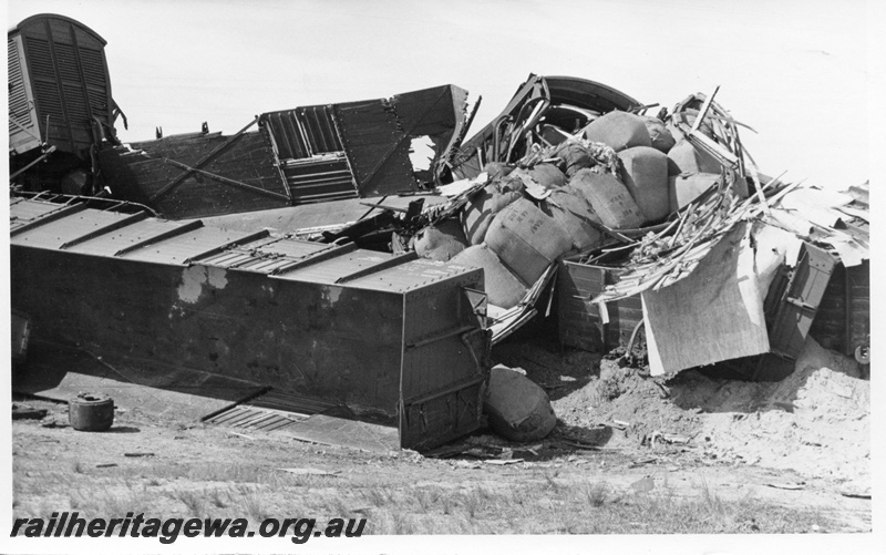 P17122
Aftermath of smash, overturned and damaged goods wagon and vans, Booraan, EGR line
