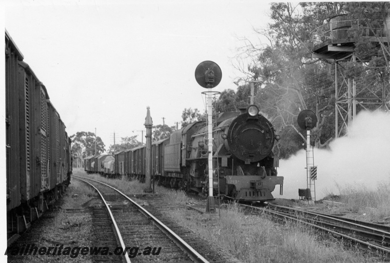 P17189
V class 1213, on goods train No 6, water tower, signal, crossing No 11 goods train, Koojedda, ER line
