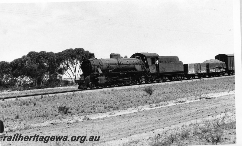 P17304
W class 903 at the head of No 69 freight. Side view of locomotive. NKM line.
