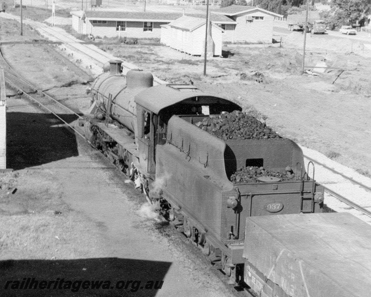 P17306
W Class 937 arriving with No 37 goods from Corrigin, Merredin, ER line. Note the buildings in the right background which were part of the Electrical Branch. Standard gauge trackage to right of train.
