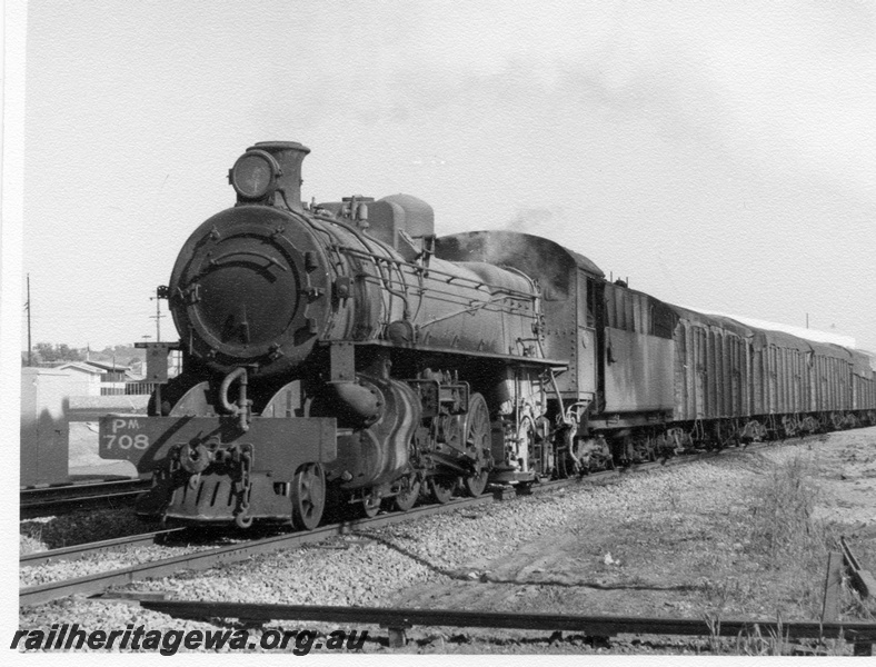 P17314
PM class 708 steam locomotive hauling No. 53 Goods from Avon Yard to Goomalling passing the former East Northam. Front & side view of locomotive, bogie high sided wheat wagons behind locomotive.
