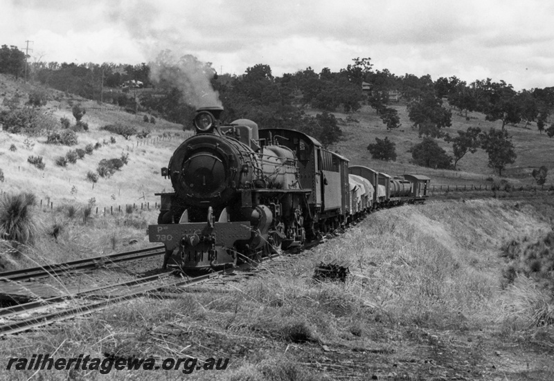 P17315
PMR class 730 locomotive hauling a freight train on the former ER Line. Location Unknown. 
