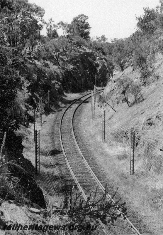 P17321
The electric fence erected on the down line of the tunnel deviation east of Swan View. ER line. The fence was erected to provide advanced warning of rock slides.
