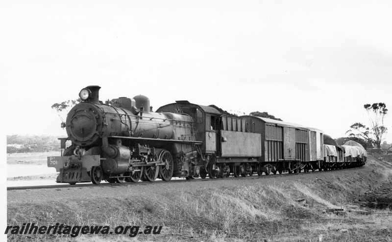 P17356
PM class 701 steam locomotive, on goods train, front and side view, near Dumberning, BN line.
