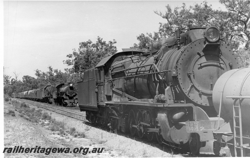 P17378
S class 542 steam locomotive, with water tanker between loco and balance of train, crossing W class 920 and S class locomotive 546 at Shotts siding. BN line. 3/4 view of right side of S class 542.
