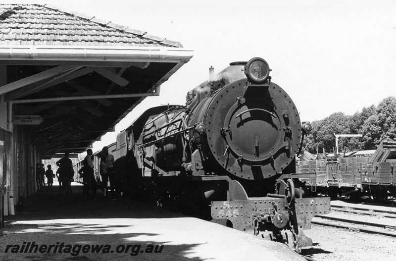 P17465
S class 545 steam locomotive 'Dale' at Donnybrook Station. PP line. View of front of locomotive. Note freight wagons at right of locomotive and view of part of station roof. 
