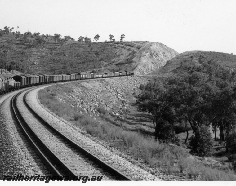 P17505
Steam loco on goods train, passing through cutting, dual gauge track in foreground, Avon Valley line, c1966
