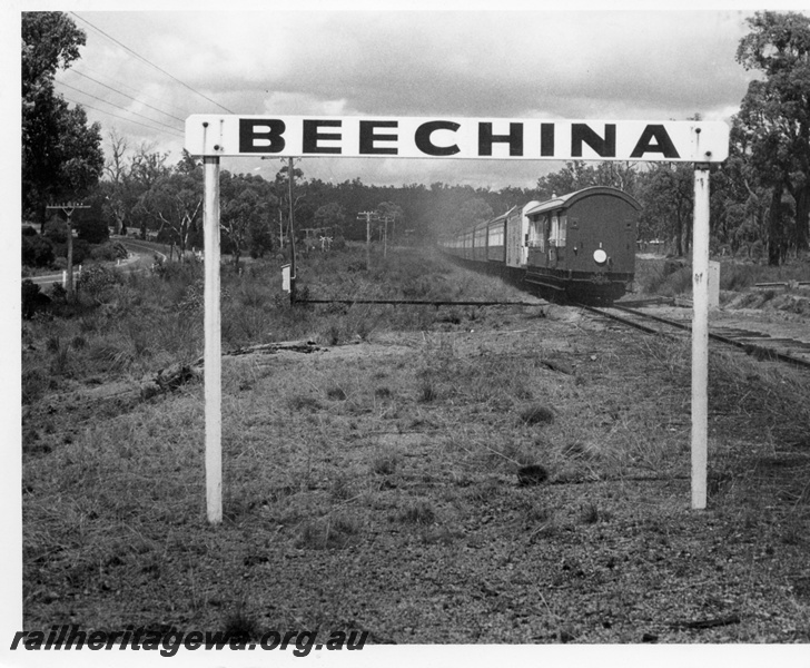 P17600
The rear of the last Westland Express traversing the narrow gauge line at Beechina, east of Chidlow. ER line. Station  nameboard,  telegraph poles, white tail disc on the end of the brakevan.
