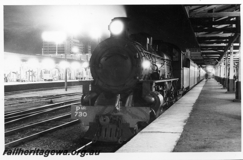 P17616
PMR class 730 steam locomotive at the head of a NSW Rail Transport Museum RESO train at Perth Station. ER Line. A night view with lights on former platform 1 and Fremantle Dock visible.
