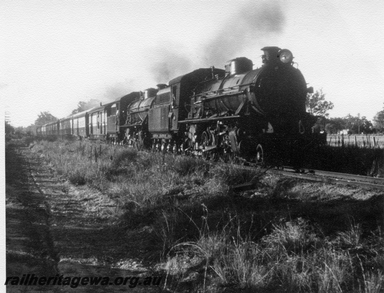 P17617
2 unidentified W class steam locomotives hauling the NSW Rail Transport Museum RESO train at an Unknown location (possibly South West line).
