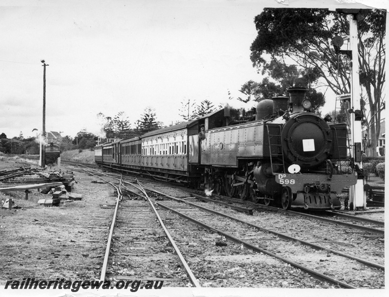 P17632
DD class 598 steam locomotive hauling a Royal Show Special with a white disc on running board and white square on smoke box, double slip, entering Claremont, ER line
