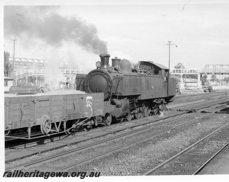 P17655
DD class 597 steam locomotive at Midland. ER line. Note RA bogie open wagon and overhead footbridge leading to Midland Workshops.
