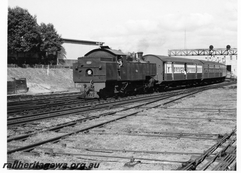 P17663
DD class 575 steam locomotive working a Midland to Perth afternoon suburban commuter service on the approach to City station. ER line. Note the signal gantry in the background.
