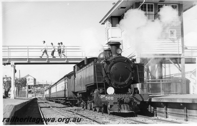 P17673
DM class 588, on Show train, signal box, pedestrians crossing overhead footbridge, Claremont station, ER line
