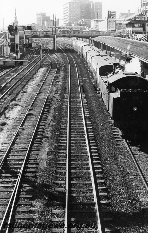 P17709
DD class 591, bunker first, on passenger train, C Cabin, bracket signal, Barrack Street bridge, Perth station, c1968
