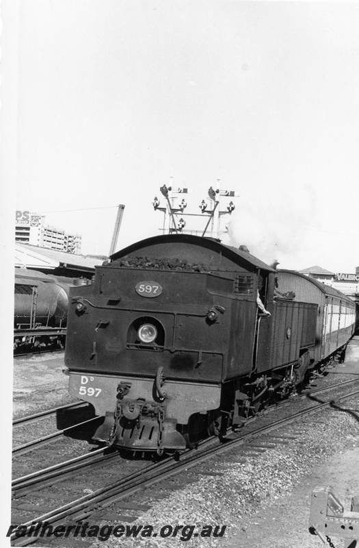 P17711
DD class 997, bunker first, on rake of empty passenger carriages, bracket signal, Perth station
