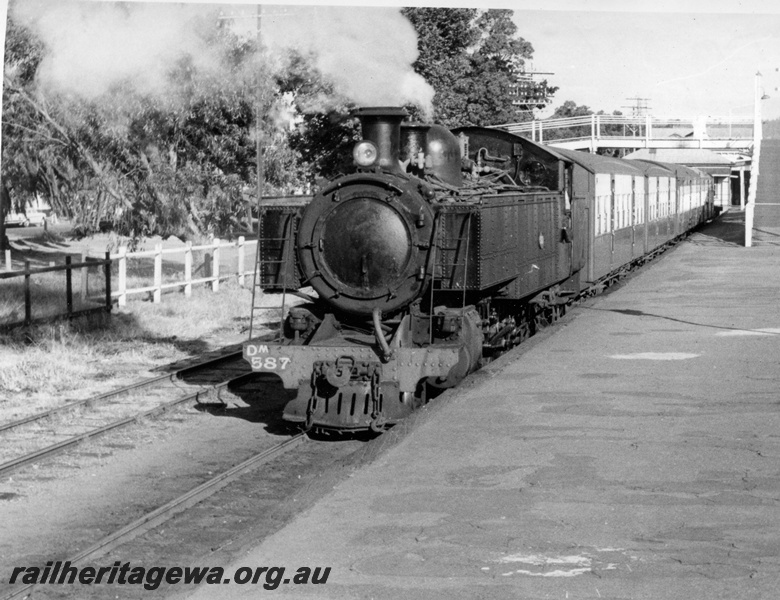 P17721
1 of 2, DM class 587 steam locomotive on suburban passenger working, front and side view, footbridge, platform, semaphore signals, Midland, ER line.
