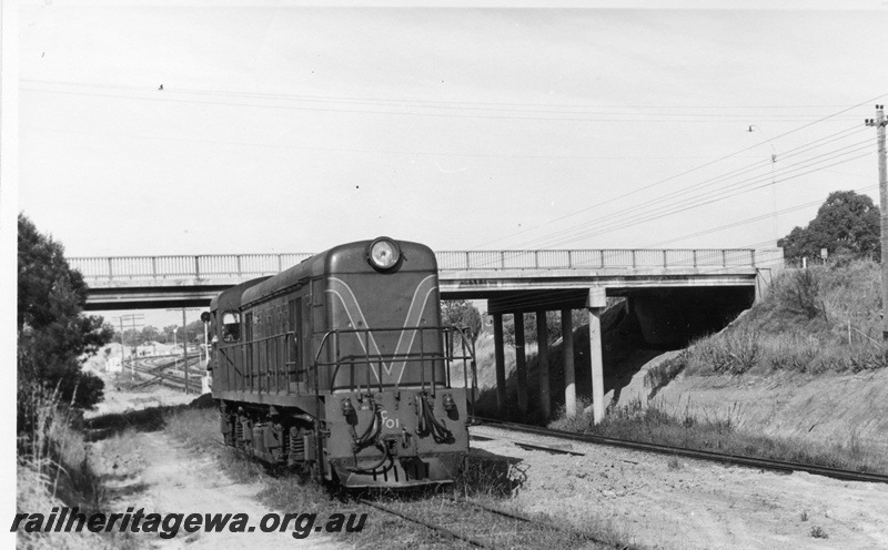 P17746
2 of 9 Rail reclamation on old ER line. C class 1701, long hood leading, running light to National Park to pick up reclaimed rails, road bridge, ER line
