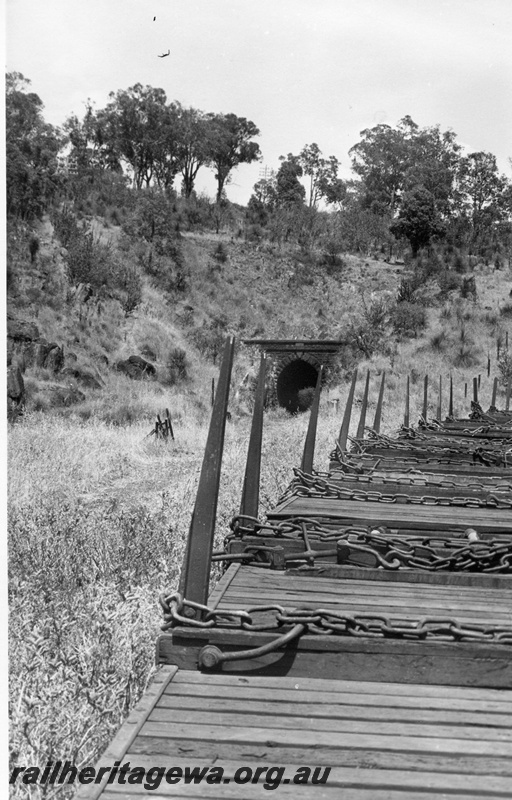 P17753
9 of 9 Rail reclamation on old ER line. Tunnel mouth, as seen from empty wagons on reclamation train, Swan View, ER line, only tunnel on WAGR
