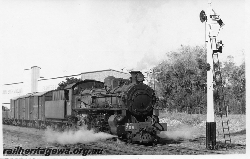 P17754
PMR class 729 steam locomotive departing Picton Junction enroute to Bunbury. SWR line. Semaphore signal in front of train and fertiliser works in the background. Front and part side view of locomotive.
