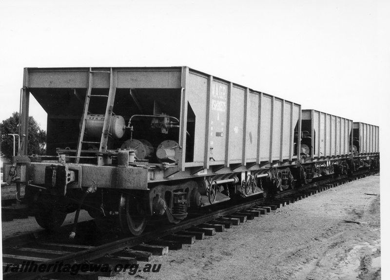 P17873
A rake of WSH standard gauge empty ballast hoppers possibly at Millendon.
