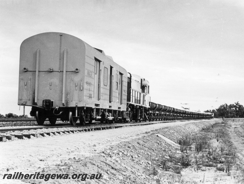 P18015
Ballast train, standard gauge, comprising WBA class 801, diesel loco, ballast wagons, Kenwick, track level view
