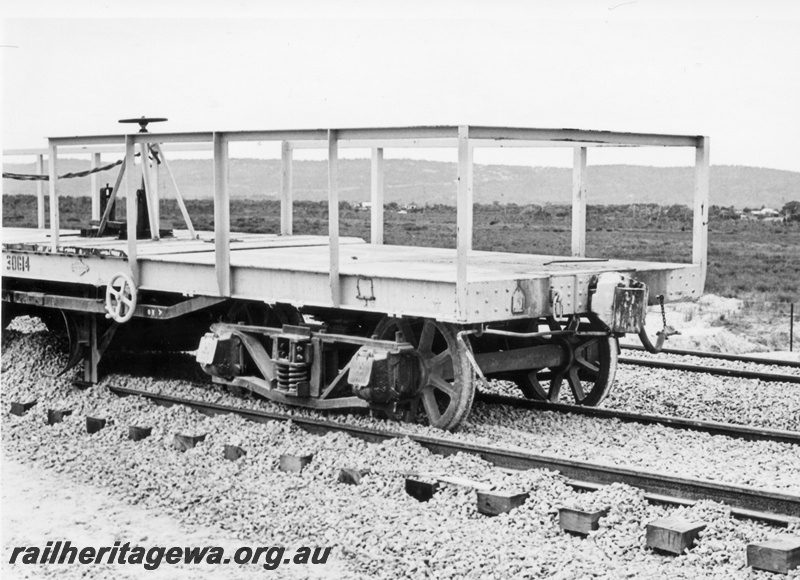 P18017
Derailed wagon, WSP class standard gauge ballast plough, Brixton Street crossing, Kenwick, side and end view of half of wagon
