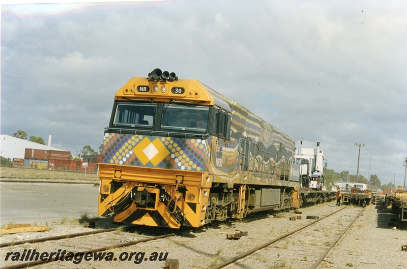 P18037
NR class 30, in indigenous livery, containers, flat wagons, Kewdale, front and side view
